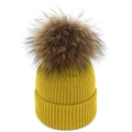 Mosterdgele ribgebreide muts voor dames met een pluizige oversized imitatiebont pompon - M / Geel