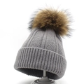 Grey knitted beanie with raccoon fur pompom and wide ribbed cuff for winter warmth - M (56-58cm) / Medium Grey
