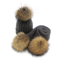 Dark grey knitted winter hat and scarf set with large brown fur pom-poms on white background - Adult Style / Dark Gray