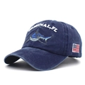 Detail of shark embroidery and vintage washed cotton on a navy baseball cap - Adjustable / Navy Blue