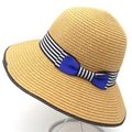 Women's summer straw sun hat with striped ribbon and blue bow on a white display stand - Khaki
