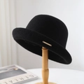 Elegant black wool felt bowler hat with gold metal plate detail on wooden stand - One Size / Black