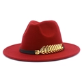 Close-up of golden feather metal buckle on dark red wool felt jazz fedora hat - Burgundy