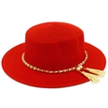 Detailed view of red straw boater hat with gold chain, white pearls and beige tassels - Red