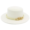 Detail of white boater hat with a chic gold metal chain and woven straw texture - White