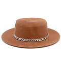 Detail of woven straw boater hat featuring a stylish silver metal chain decoration - Deep Pink