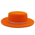 Detail of bright orange flat top straw hat featuring a chunky gold metal chain link band - Orange