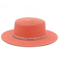 Detail of coral orange flat top straw hat with decorative chunky silver metal chain link - Pink