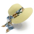 Women's summer straw sun hat with wide brim and elegant floral ribbon decoration - Beige