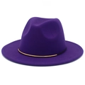 Macro shot of purple wool fedora hat featuring a gold metallic band and felt texture - Purple