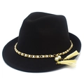 Detail view of a black wool fedora with gold chain, white pearls and elegant tassels - One Size / Black