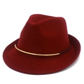 Close-up of wine red fedora hat with elegant gold metal bar and black decorative string - Burgundy