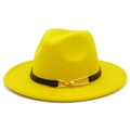 Detail of a bright yellow fedora hat featuring a black leather belt with a gold buckle - Yellow