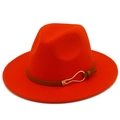 Detailed close-up of a red wide-brim fedora hat with a brown leather band and gold buckle - Orange Red