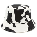 Close-up of black and white cow print pattern on a high-quality cotton bucket hat - Black