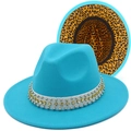 Detailed view of teal fedora hat with leopard print lining and rhinestone studded band - Sky Blue