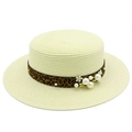Detail of boater straw hat with leopard ribbon, pearls and floral accents for beach - Off White