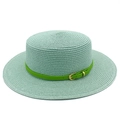 Detail of mint green straw hat showing spiral woven texture and green leather band - Mint Green