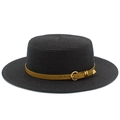Close-up of dark woven straw boater hat with mustard leather band and golden hardware - Black