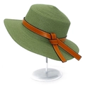 Close-up of green straw sun hat featuring a brown leather band and detailed stitching - One Size / Grass Green