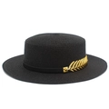 Detail of black flat-top straw boater hat with a side-mounted golden leaf ornament - Black