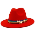 Detail of red fedora hat featuring rainbow glitter band with white pearls and flower - Red