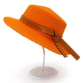 Detailed macro view of bright orange straw hat featuring a brown leather bow and white stitching - One Size / Orange