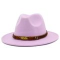 Detailed view of pink fedora hat with gold feather pendant and beaded decorative band - Light Purple