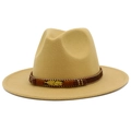 Close-up of khaki wool fedora hat with ethnic beaded band and golden feather charm - Camel