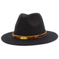 Detail of black wool fedora featuring a woven brown band and golden feather pendant - Black