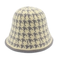 Close-up of the grey and beige houndstooth pattern texture on this knitted bucket hat - One Size / Gray