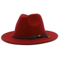 Detailed macro view of dark red wool fedora with black braided cord and bronze arrow charm - Burgundy