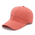 Detailed view of 3D embroidered UNPLUGGED text on a coral pink cotton baseball cap - One Size / Watermelon red