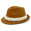 Close-up of brown wool jazz hat featuring elegant white pearl bead decorations on the band - Brown