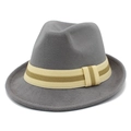 Detail of dark grey wool fedora hat with striped woven ribbon trim on white background - Gray