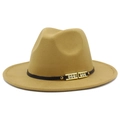 Close-up of camel wool fedora hat with a black band and crystal-studded gold buckle - Camel