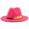 Detailed close-up of hot pink wool fedora hat featuring black leather band and golden leaf charm - Rose Red