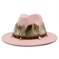 Detail of pink fedora hat featuring ethnic ribbon, natural feathers and metallic charms - Pink