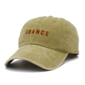 Close-up of the CHANCE embroidery and washed cotton fabric texture on the baseball cap - Khaki