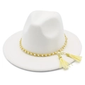 Detail of white felt fedora hat featuring gold chain, faux pearls, and tassel charms - White