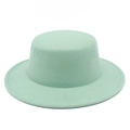 Detailed close-up showing the flat top structure and mint green wool felt of the hat - Mint Green