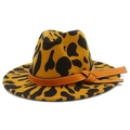 Detail of wide brim cow print fedora hat featuring a brown leather band and stitching - One Size / Brown Leopard