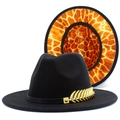 Detail showing the golden leaf accessory and giraffe pattern on the black fedora inner brim - One Size / Black Outer Giraffe Lining