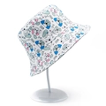 White bucket hat with cartoon dog prints and WOOF text on a white display stand - Cartoon Dog Pattern (BS188)