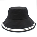 Detail of a black cotton bucket hat with white double stripe trim and wide brim - One Size / Black