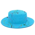 Macro detail of a bright blue woven straw boater hat with colorful artistic paint splatters - Blue