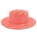 Detail of coral pink boater hat with colorful artistic paint splatter texture - Rose Red