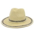 Detailed close-up of straw sun hat featuring elegant pearls and metallic stud decorations - Khaki
