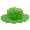 Green straw Panama hat with colorful graffiti paint splatters and wide brim for beach sun protection - Green