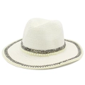 Close-up of white straw Fedora hat featuring elegant pearl and grey beaded trim details - White
